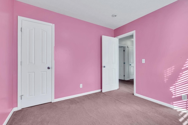 unfurnished bedroom with carpet floors