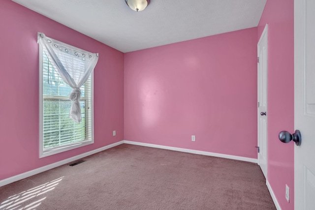 unfurnished room featuring carpet flooring