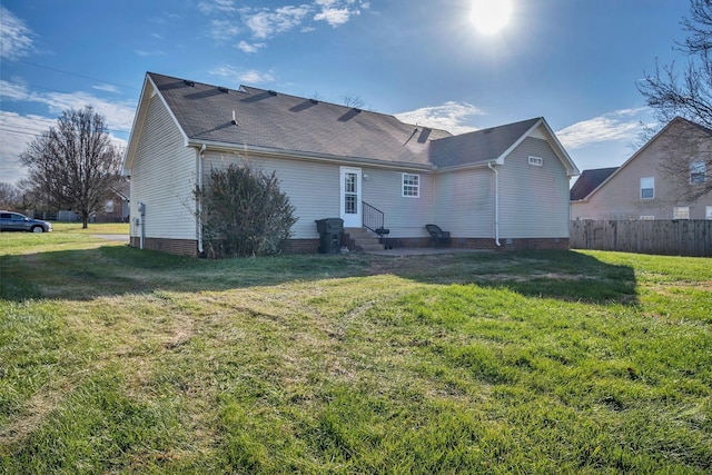 back of house with a yard