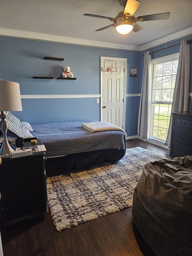 bedroom featuring ceiling fan, hardwood / wood-style flooring, and ornamental molding