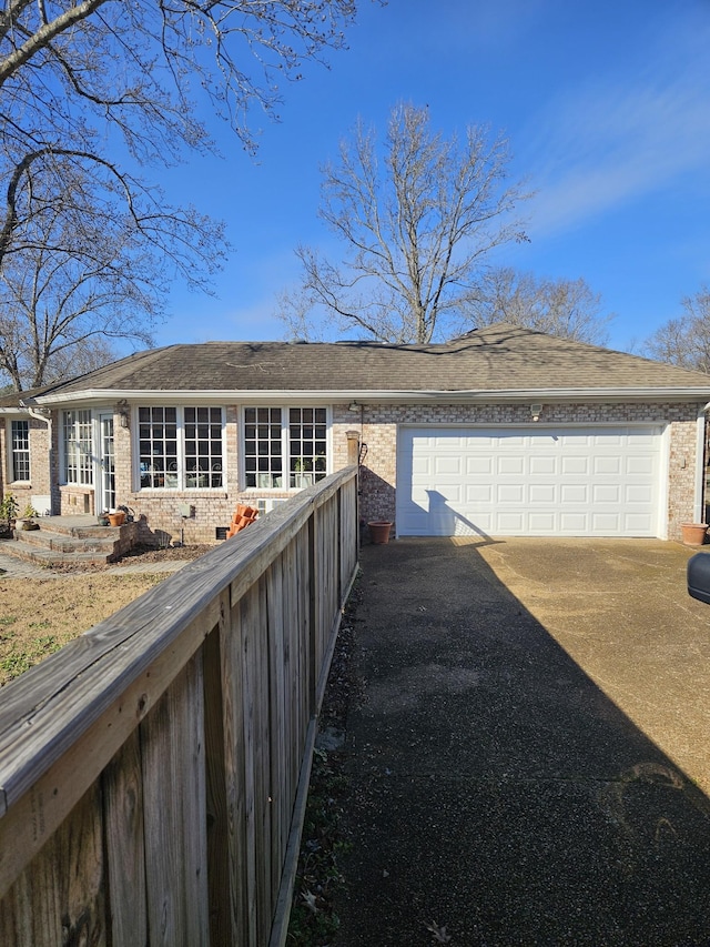 view of side of home with a garage