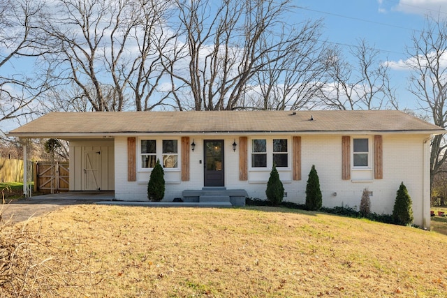 single story home featuring a front yard and a carport