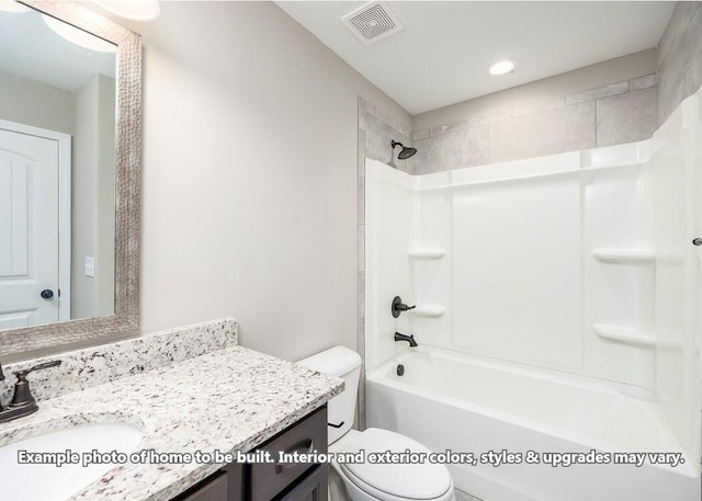 full bathroom featuring vanity, tiled shower / bath combo, and toilet