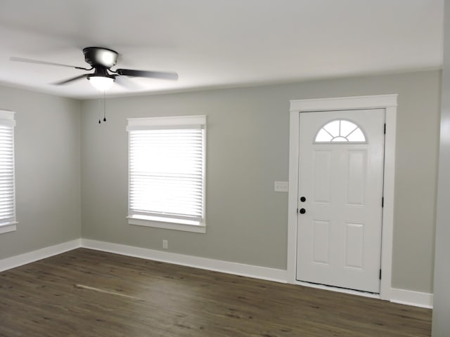 entryway with dark hardwood / wood-style flooring and ceiling fan