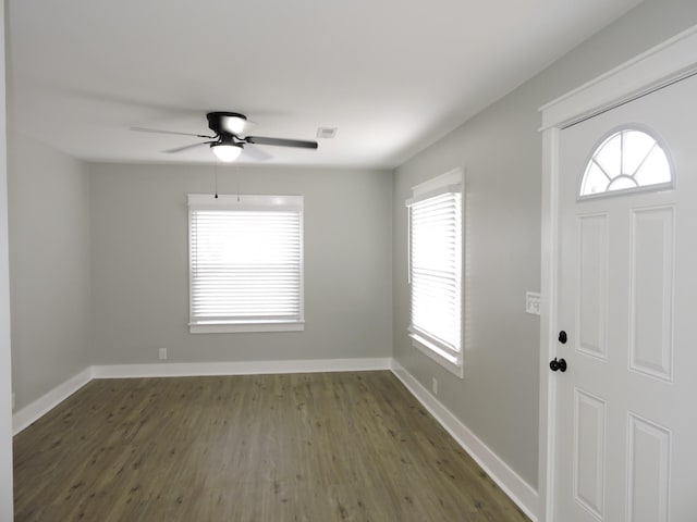 foyer entrance with dark hardwood / wood-style floors and ceiling fan