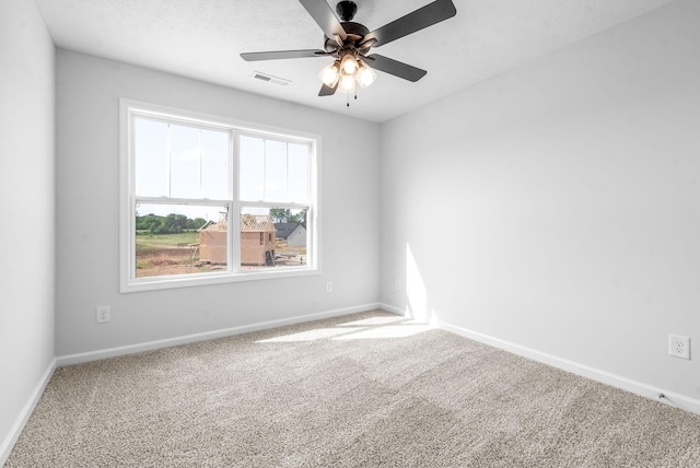 unfurnished room featuring carpet flooring and ceiling fan