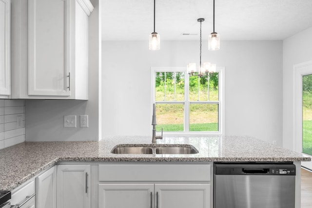 kitchen with dishwasher, light stone countertops, white cabinetry, and sink