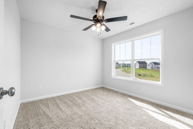 carpeted empty room with ceiling fan