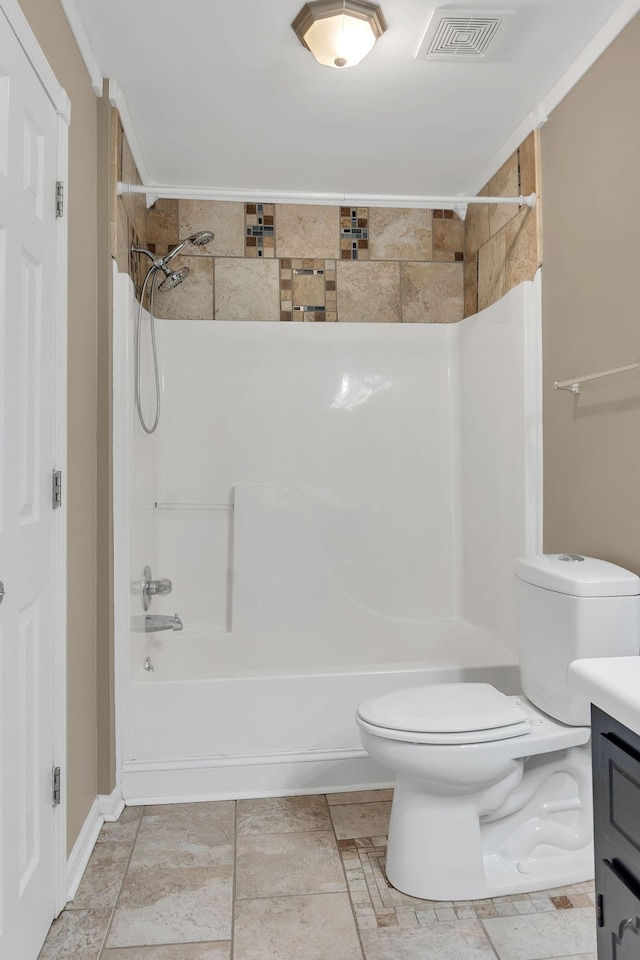 bathroom featuring toilet, vanity, and ornamental molding