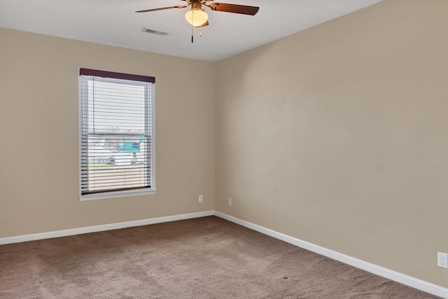 empty room with ceiling fan, carpet floors, and a healthy amount of sunlight