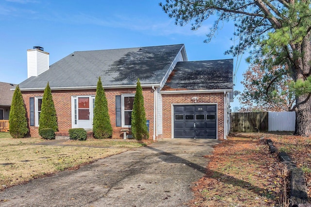 view of front of home with a garage and a front yard