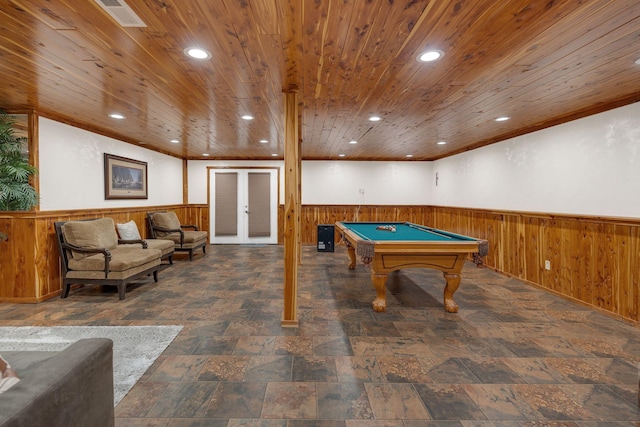 game room with french doors, wooden walls, wooden ceiling, and billiards