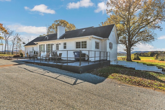 back of house with a patio