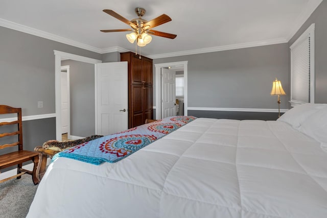 bedroom featuring carpet flooring, ceiling fan, and crown molding