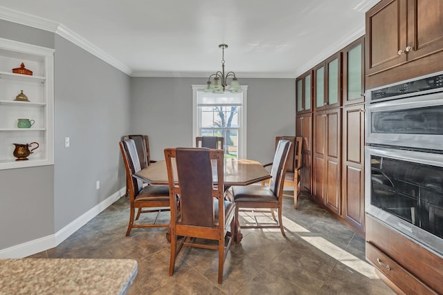 dining area featuring built in features, ornamental molding, and a chandelier