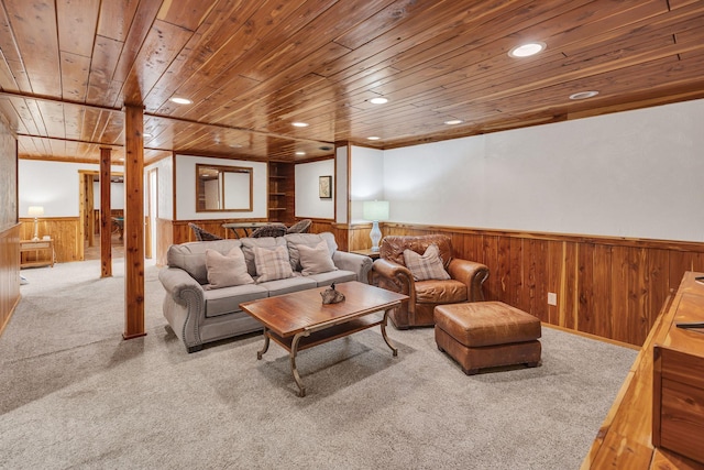 living room with wood ceiling and carpet floors