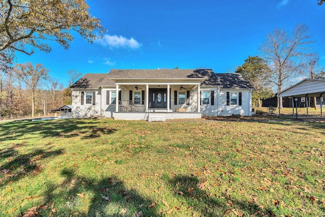 back of property featuring covered porch, a yard, and ceiling fan