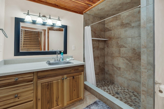 bathroom with a shower with curtain, vanity, and wooden ceiling