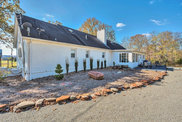 back of property with a patio area