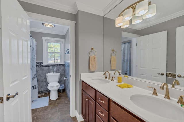 bathroom featuring vanity, crown molding, tile walls, tile patterned flooring, and toilet