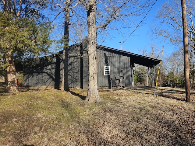 view of property exterior with an outdoor structure