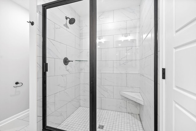 bathroom with a shower with shower door