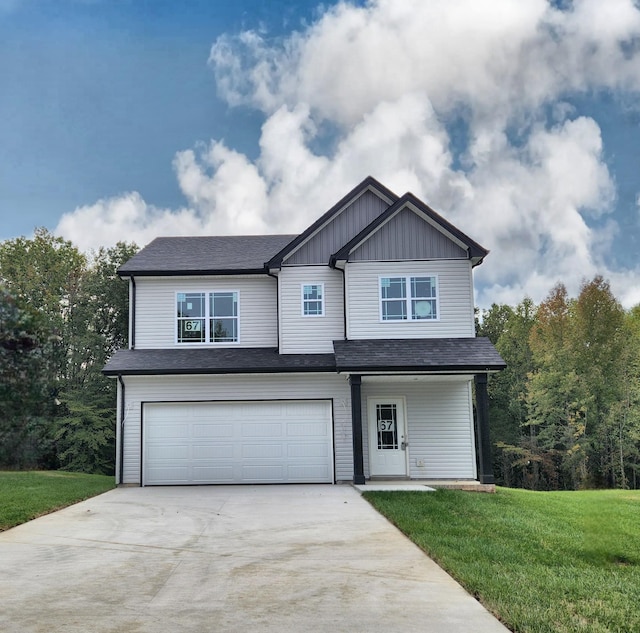 view of front facade featuring a front yard and a garage