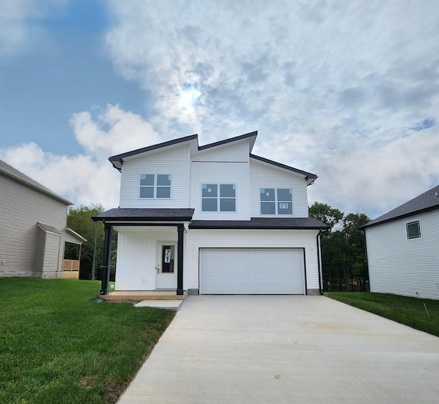 view of front facade featuring a front yard and a garage