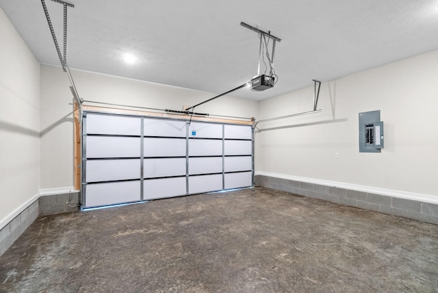 garage with electric panel and a garage door opener