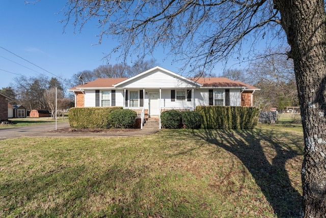 single story home featuring a front lawn and a porch