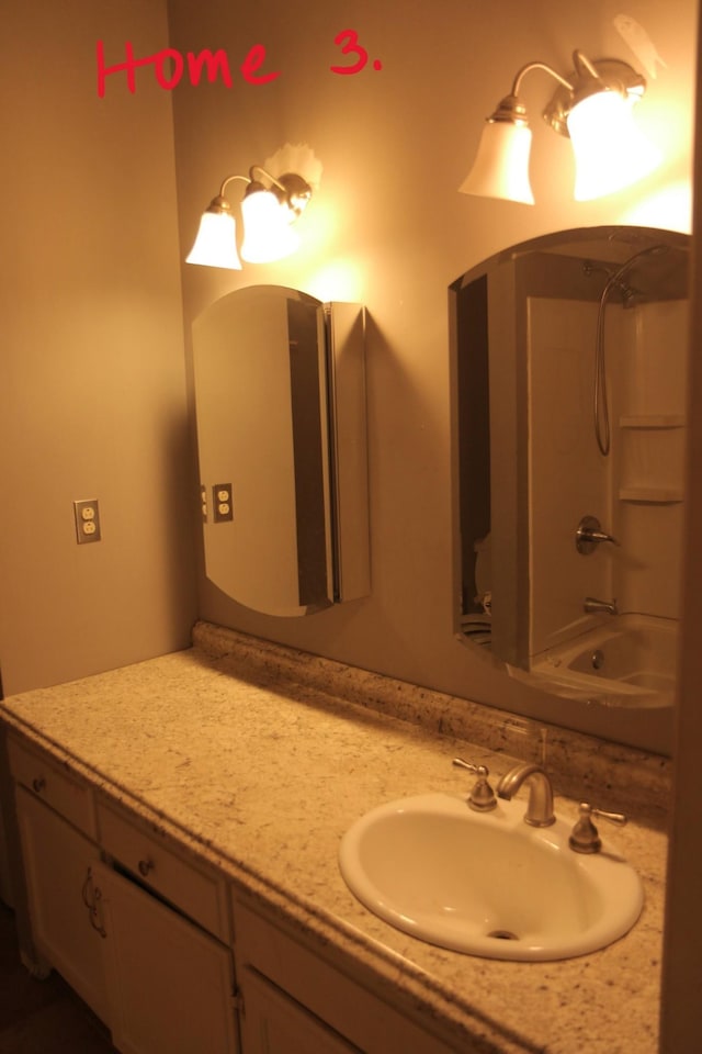 bathroom featuring shower / bathing tub combination and vanity