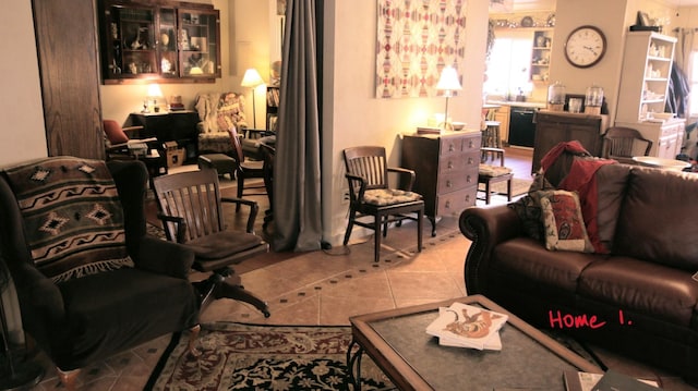 living room with light tile patterned floors