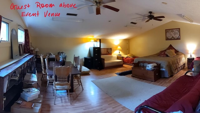 bedroom featuring ceiling fan, hardwood / wood-style floors, and lofted ceiling