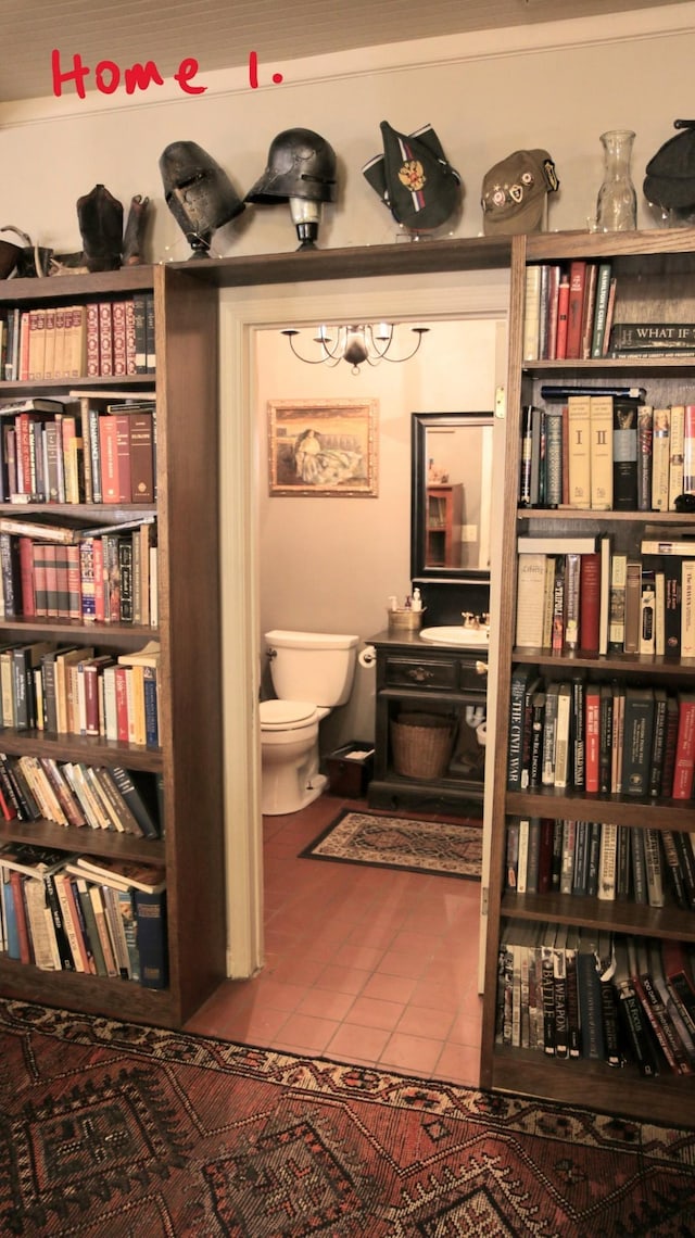 living area with tile patterned floors