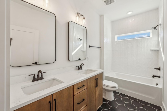 full bathroom with tile patterned flooring, vanity, shower / bathtub combination, and toilet