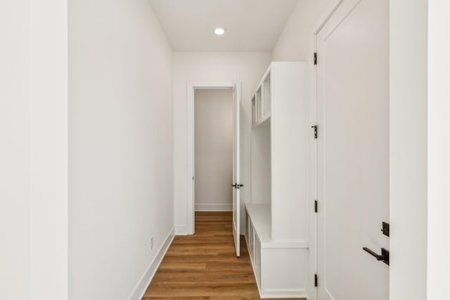 corridor featuring hardwood / wood-style floors