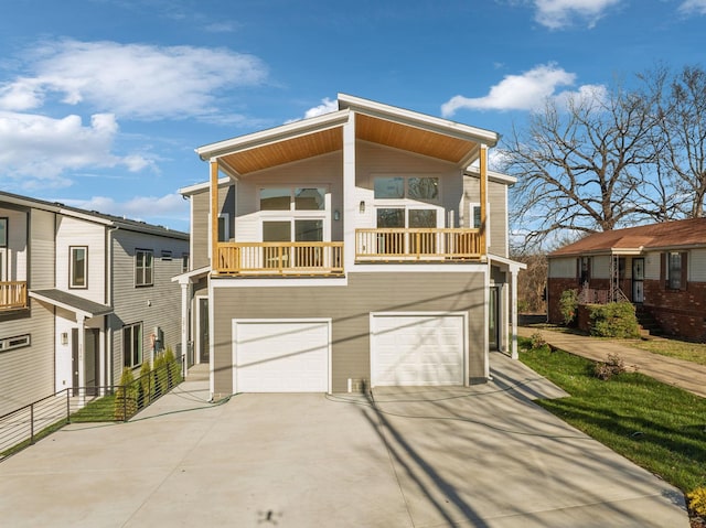 modern home featuring a balcony and a garage