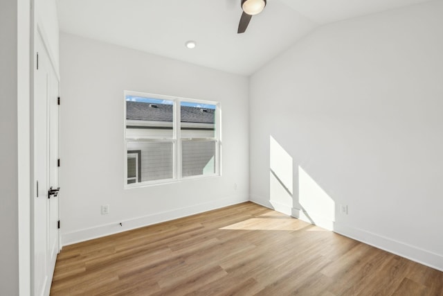 unfurnished bedroom with light wood-type flooring, vaulted ceiling, and ceiling fan