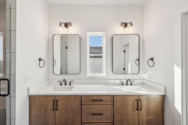 bathroom featuring vanity and an enclosed shower