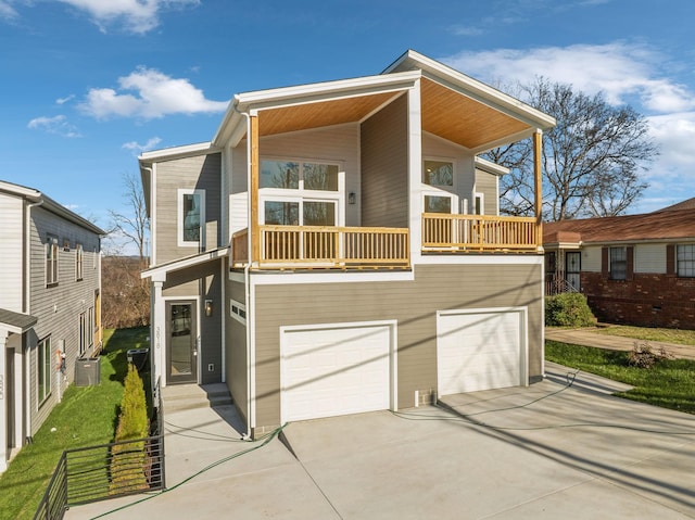 view of front of home with a balcony and a garage