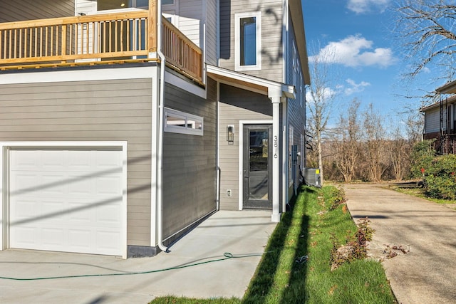 view of exterior entry featuring a balcony