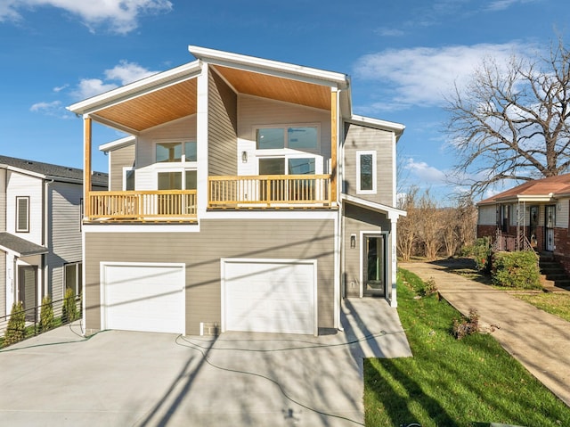 view of front facade with a balcony and a garage