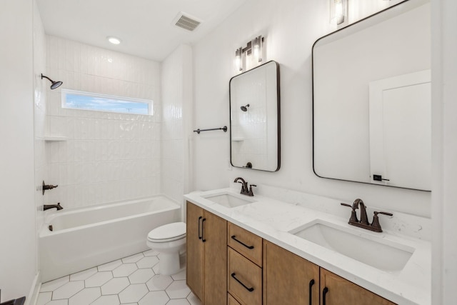 full bathroom featuring tile patterned floors, vanity, shower / bath combination, and toilet