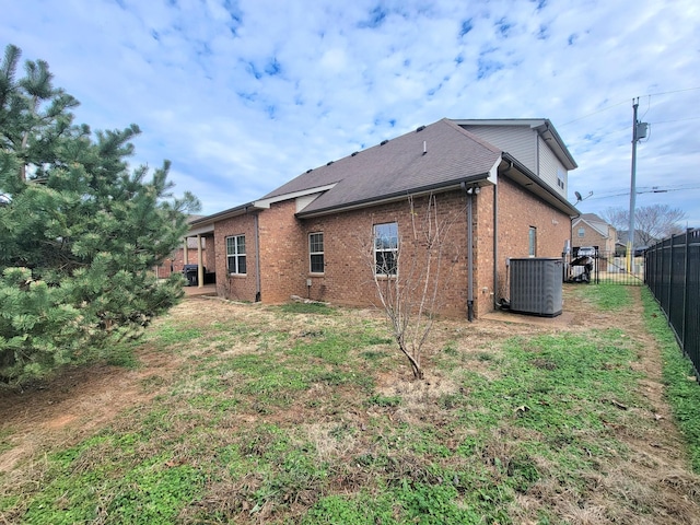 rear view of property featuring cooling unit