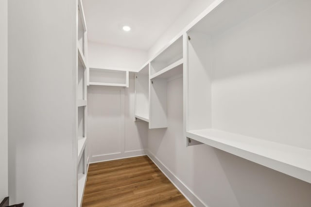 walk in closet featuring dark hardwood / wood-style floors