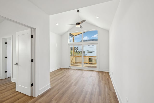 unfurnished room featuring ceiling fan, high vaulted ceiling, and light hardwood / wood-style floors