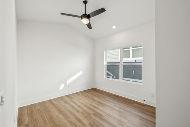 unfurnished room featuring ceiling fan, light hardwood / wood-style flooring, and vaulted ceiling