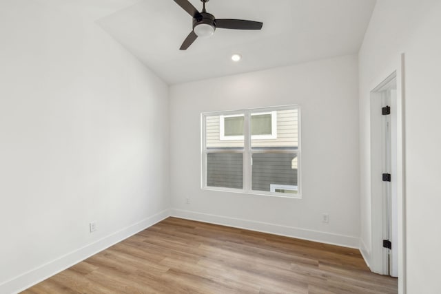 spare room featuring ceiling fan and light hardwood / wood-style floors