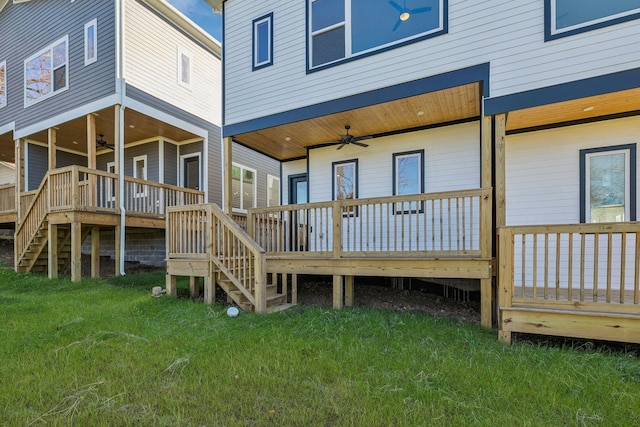 back of house with a yard, a deck, and ceiling fan