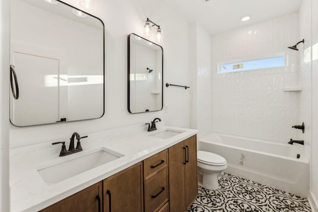 full bathroom featuring tile patterned flooring, vanity, tub / shower combination, and toilet